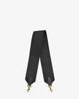 The Clare Vivier Shoulder Strap features a black cotton webbing with gold-tone clasps at both ends, showcasing a textured fabric. Made in L.A., the strap is positioned upright against a plain white background.