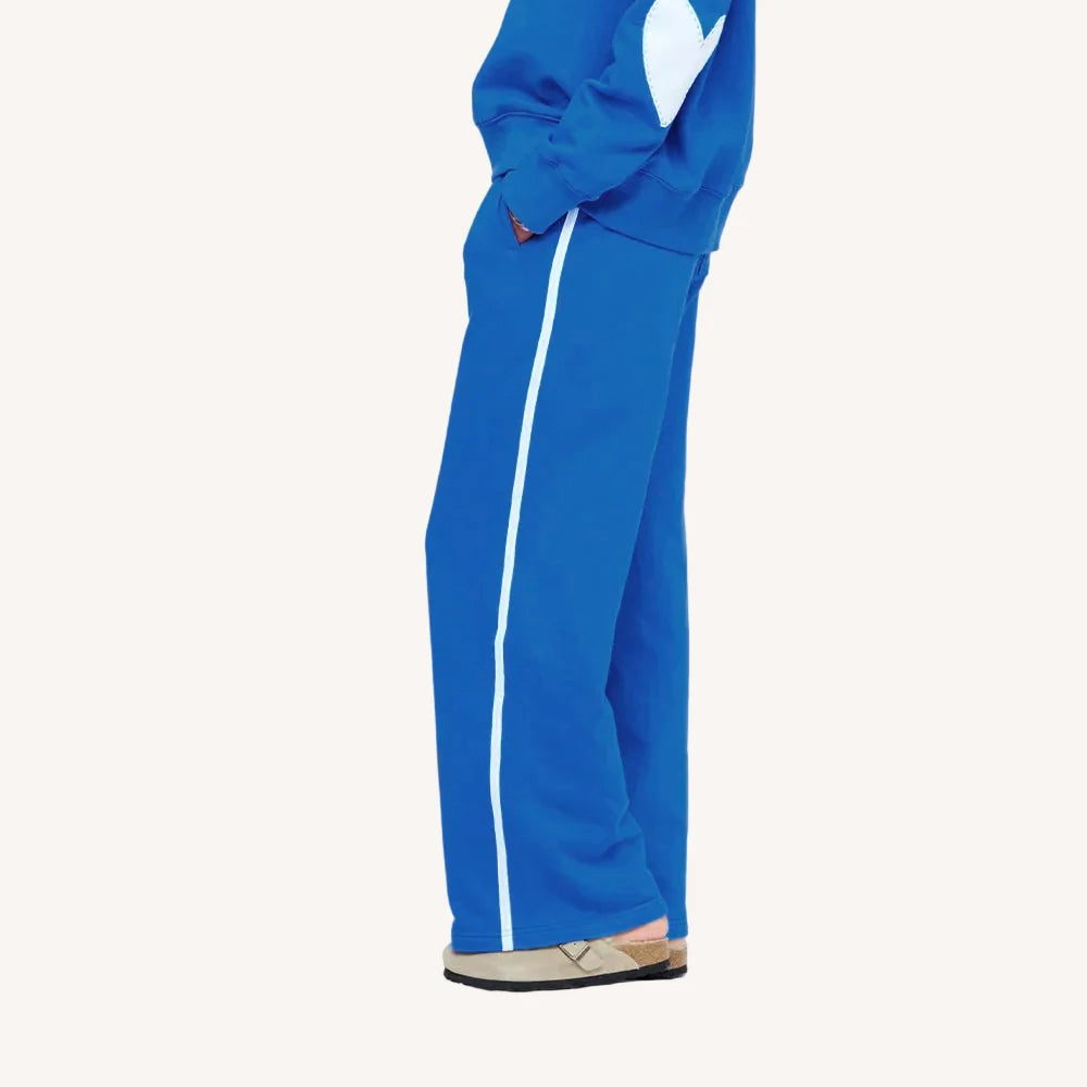 Kerri Rosenthal blue fleece palazzo pants with matching top and beige shoes, styled side view for Bungalow Furniture.