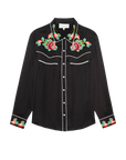 The Great Inc. Heirloom Rose Western Shirt is a long-sleeved black shirt with white piping, red and green rose embroidery on the collar, chest, and cuffs, and classic pearl snaps down the front.