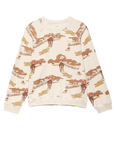 The Slouch Sweatshirt by The Great Inc. is a cream-colored top with an all-over print of cowboys on horseback riding through a western landscape, featuring trees and buildings in brown, red, and tan for a vintage-inspired look.