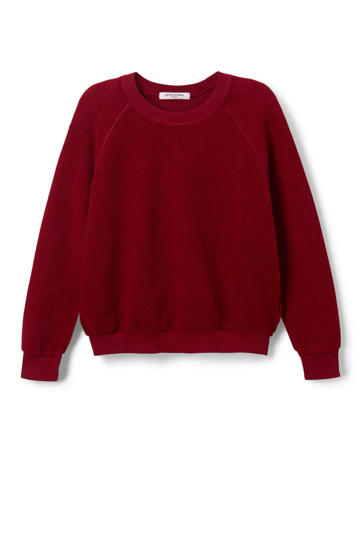 The Perfectwhitetee Ziggy Reverse LS Sweatshirt is a deep red, plain, long-sleeve crew neck with ribbed cuffs and hem, shrunken fit, shown against a white background.