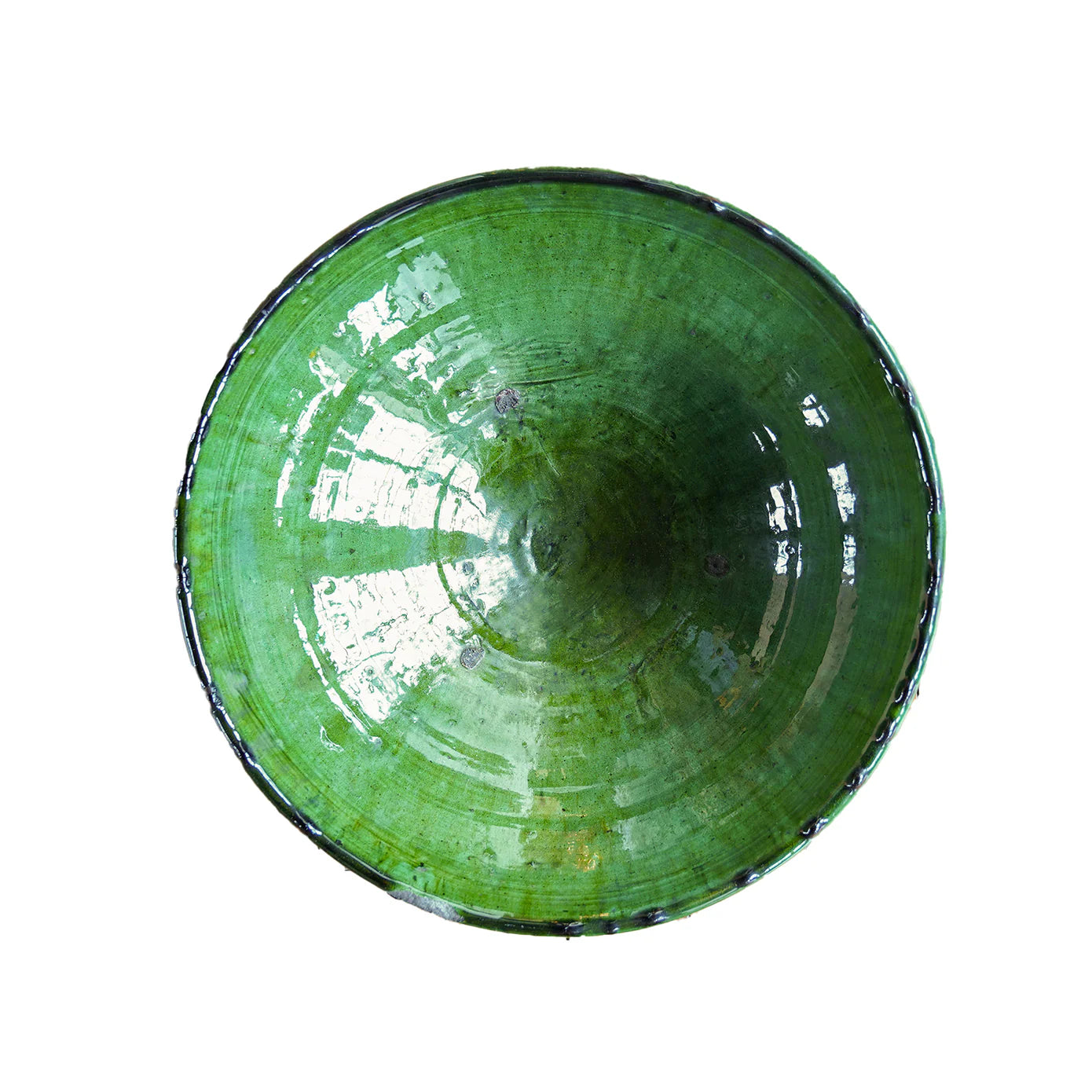 The Tamegroute Bowl by Blue Ocean Traders features a round, glossy green finish with a hand-shaped, slightly uneven rim, making it a unique decorative accent against a white background.