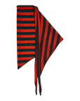 A luxurious accessory from The Great Inc., The Cashmere Neckerchief, is displayed on a flat surface. This red and black neckerchief features horizontal stripes and boasts a triangular shape with fringed ends.