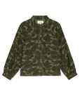 The Commodore Jacket by The Great Inc. is an oversized, green camouflage cotton sateen, long-sleeve button-up with a collar and gathered cuffs, bringing workwear style. Shown on a plain white background.
