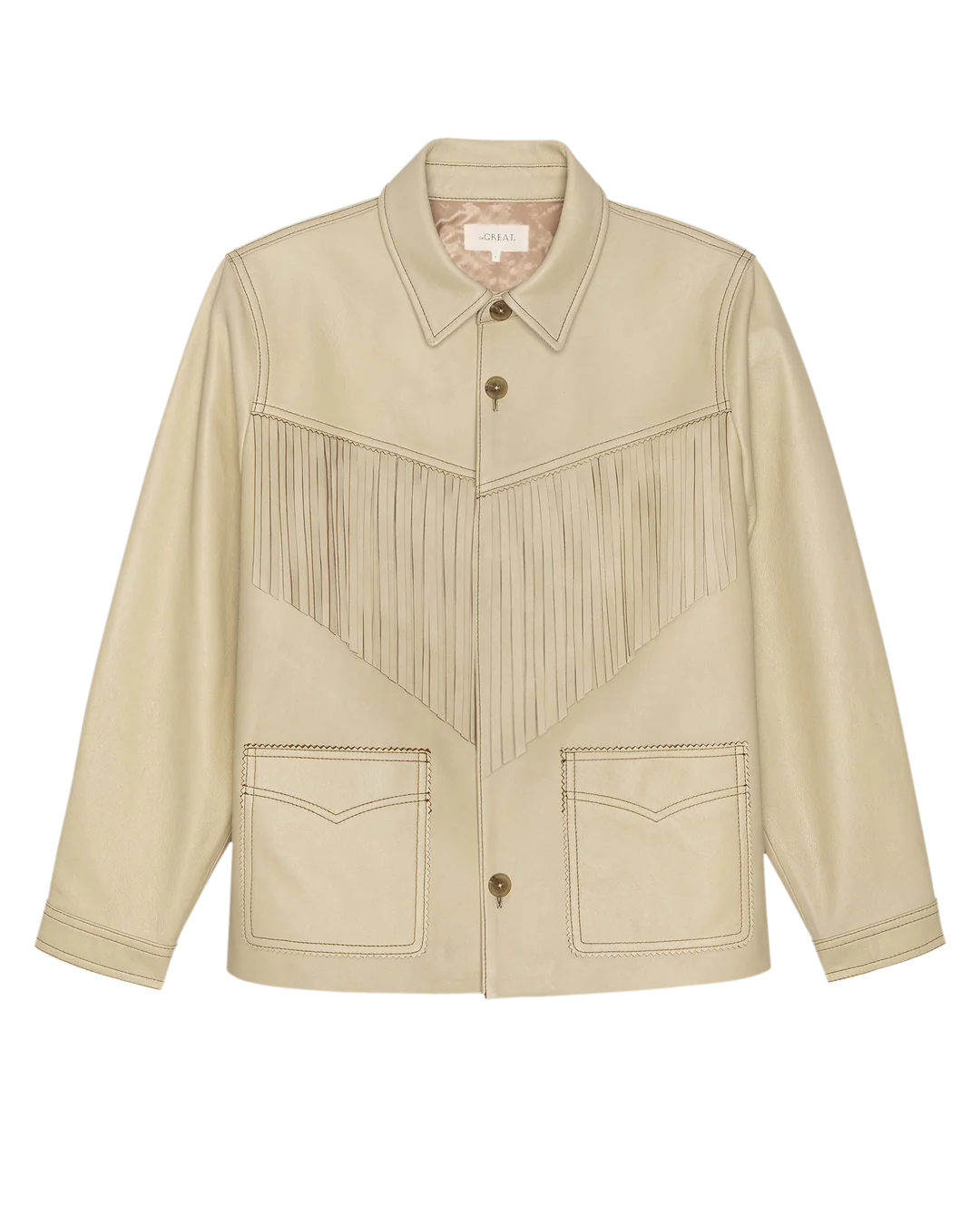 The Great Inc.'s The Leather Fringe Jacket features beige leather, a pointed collar, button front, flap pockets, and V-shaped fringe detailing across the chest for an authentic western look.