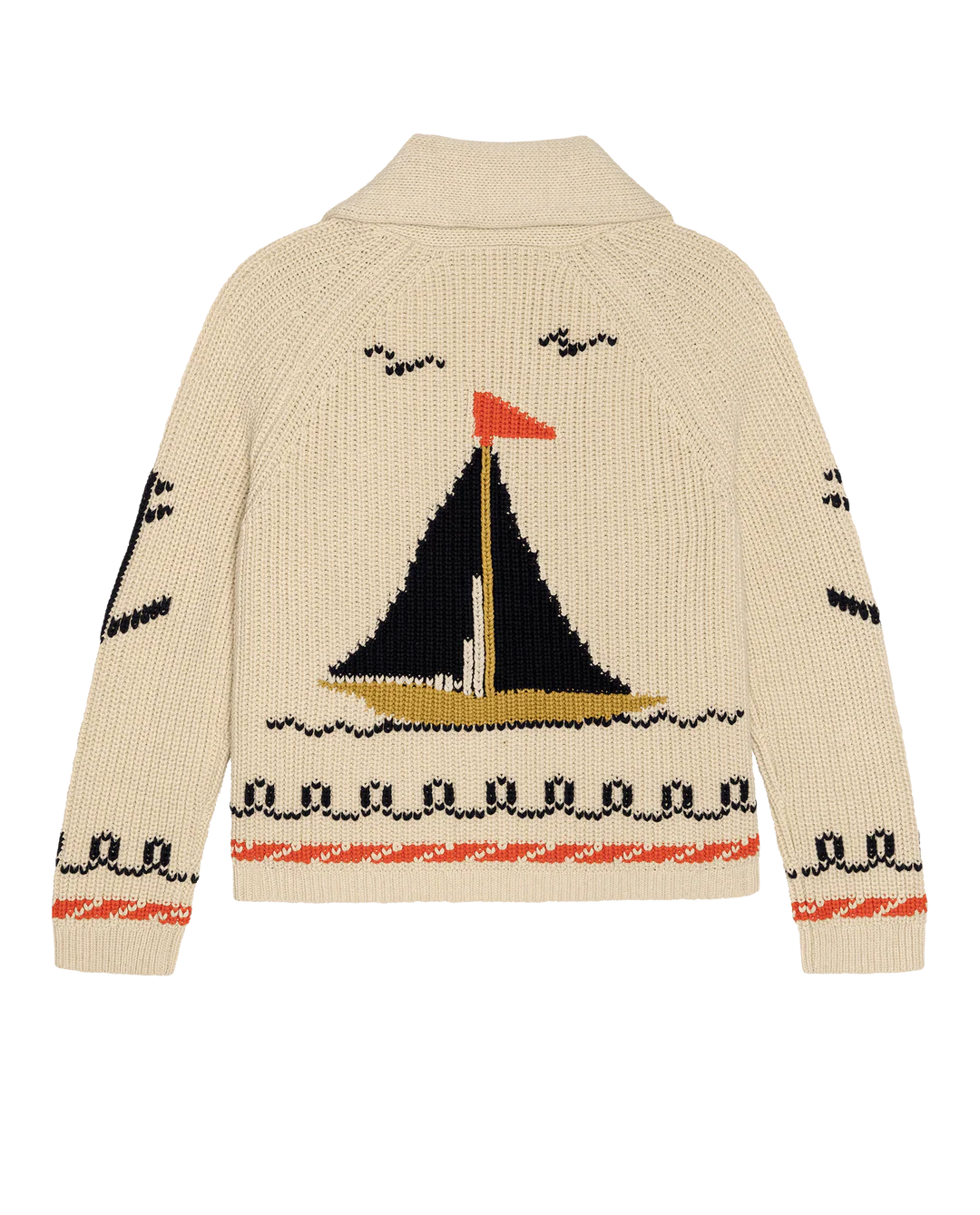 The Great Inc. Sailboat Lodge Cardigan in a beige cotton blend features a large hand-embroidered sailboat with black and yellow sails, an orange flag, bird motifs, and black and orange decorative waves on the hem and sleeves.