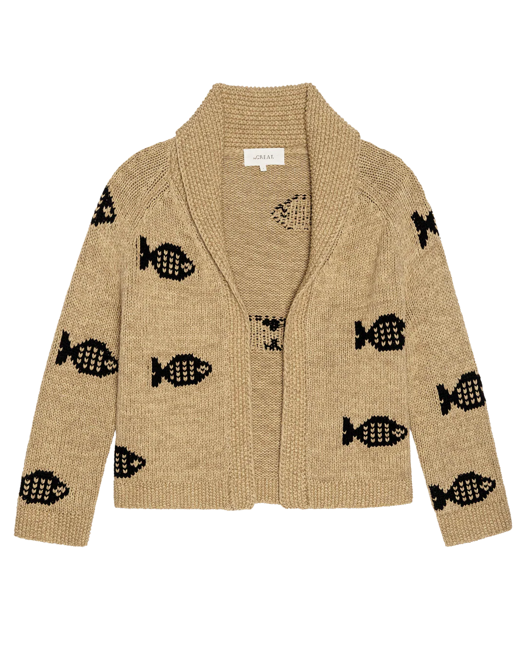 The Swimming Fish Lodge Cardigan by The Great Inc. is a beige knit with a shawl collar, featuring bold black swimming fish motifs on the sleeves and body for a cozy, standout look.