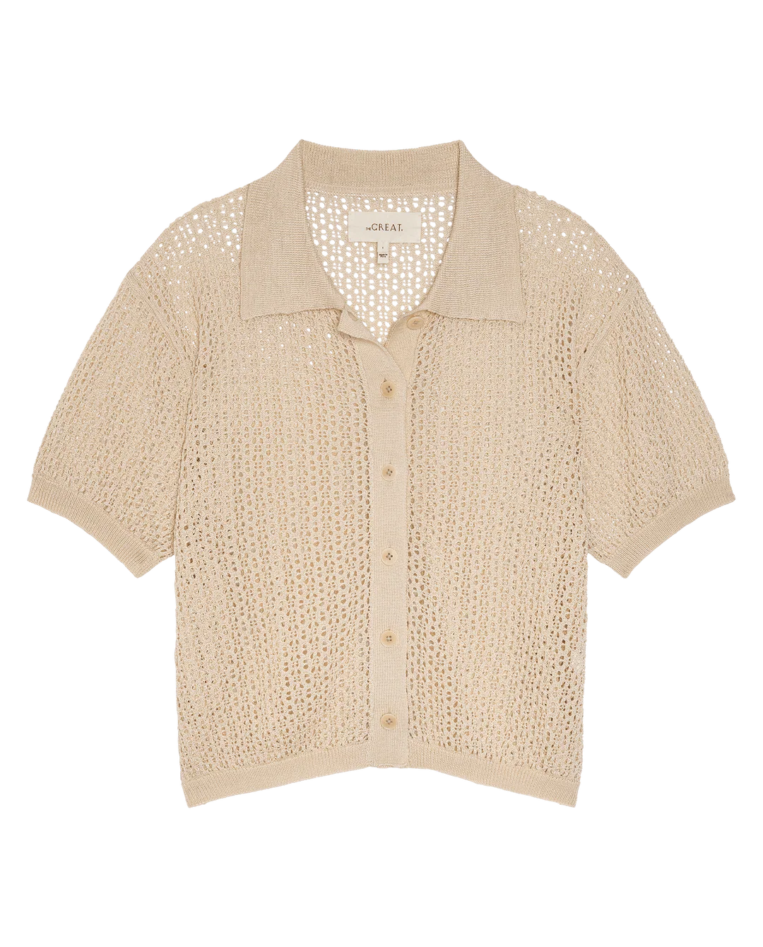 The Great Inc. The Crochet Polo—beige short-sleeve top with a pointed collar, crafted from mercerized cotton in an open-knit crochet pattern, shown flat on a white background.