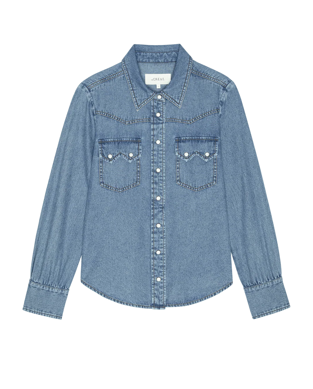 Light blue denim shirt with western yoke, chest pockets, and snaps by The Great Inc., the Howdy Top.