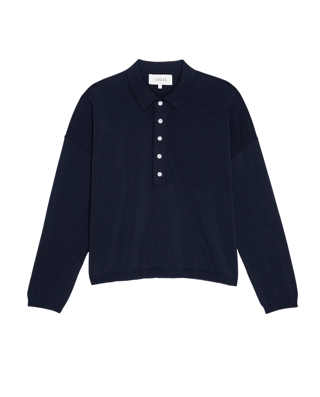 The Great Inc.'s The Polo Sweater in navy blue features a long-sleeve design with a collar and buttoned placket. Made from 100% cotton, it offers a relaxed fit with a slightly dropped shoulder, inspired by vintage menswear styles.