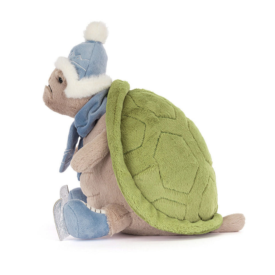Timmy Turtle Skating by Jelly Cat Inc. features a plush turtle with a green shell, blue hat with pompom, scarf, and blue ice skates—adorable on a white background and perfect for festive gifting.