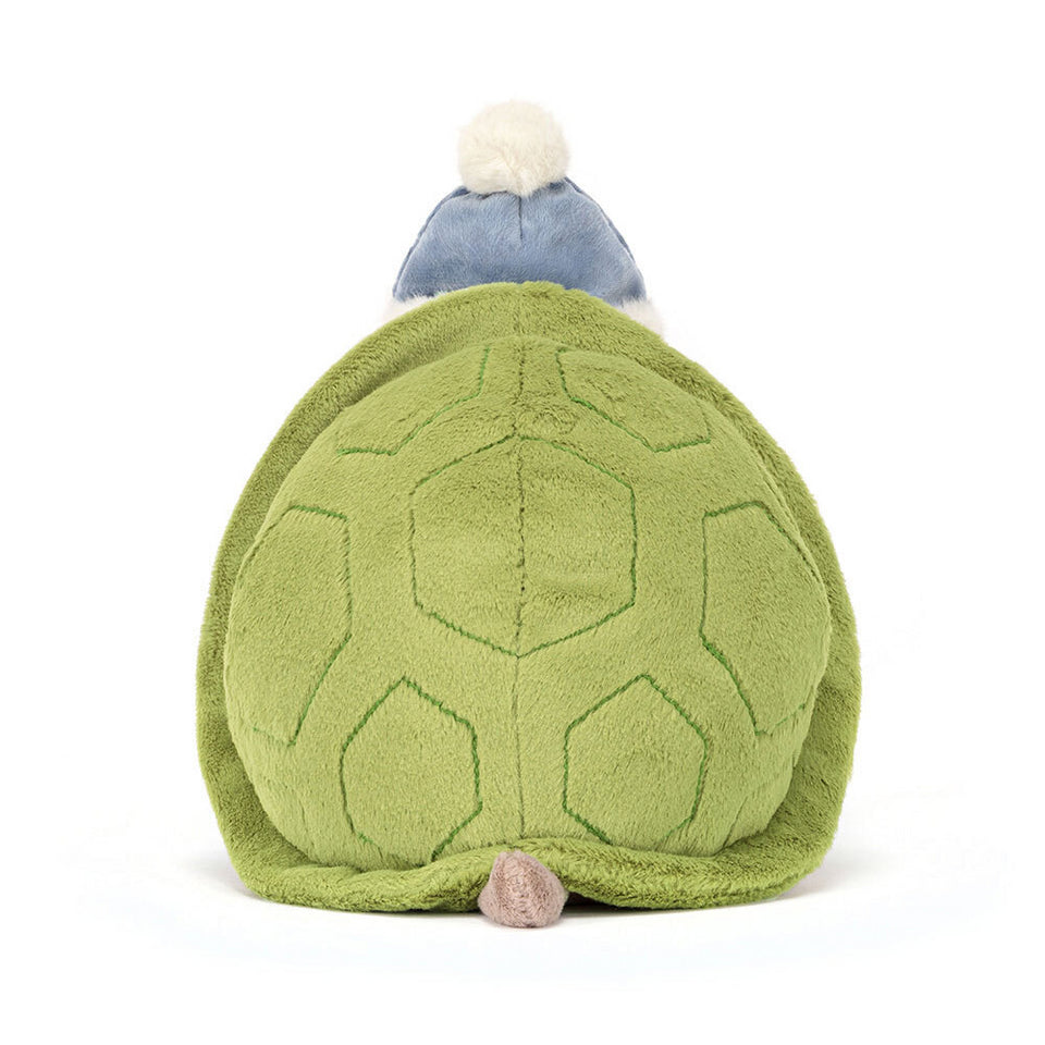 Timmy Turtle Skating by Jelly Cat Inc. is a plush festive turtle with a green stitched shell, brown tail, and blue winter hat with white pom-pom—ready for winter adventures!.