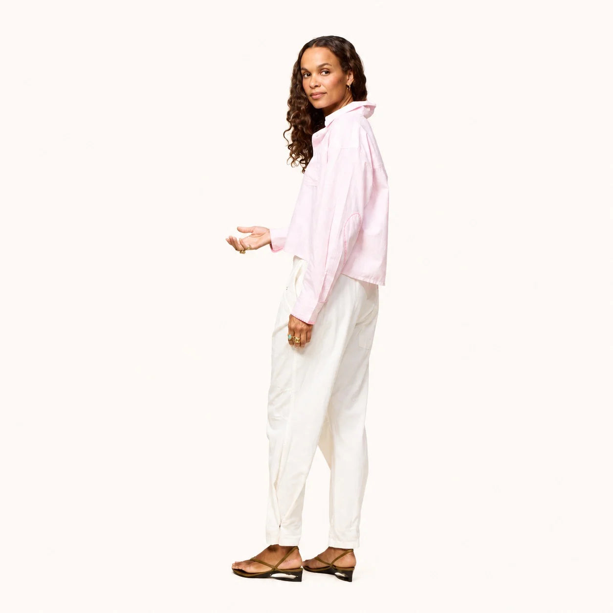 Kerri Rosenthal Tia Love Stripe Shirt in multicolor, paired with white pants and brown flats, modern minimal setting.
