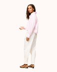 Kerri Rosenthal Tia Love Stripe Shirt in multicolor, paired with white pants and brown flats, modern minimal setting.