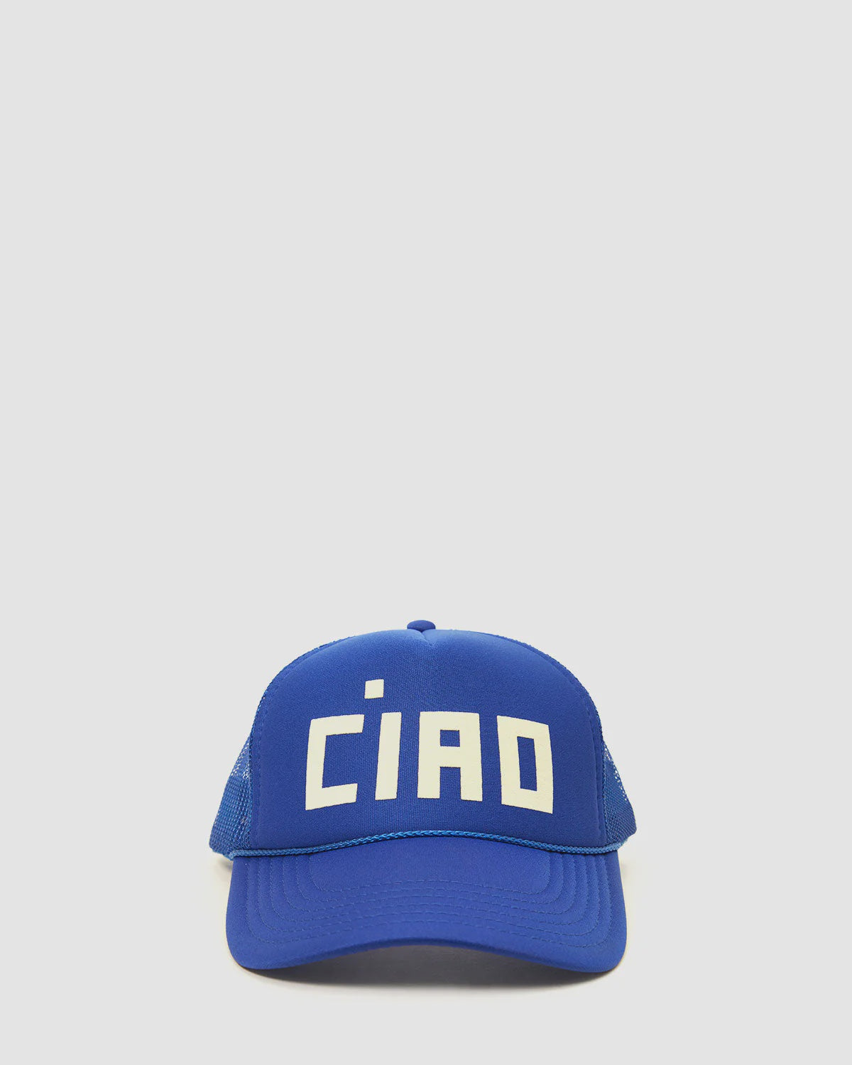 The Clare Vivier Trucker Hat Ciao features a blue design with a mesh back and "CIAO" in bold white letters, making this unisex accessory an effortless style statement. Displayed on a plain light background.