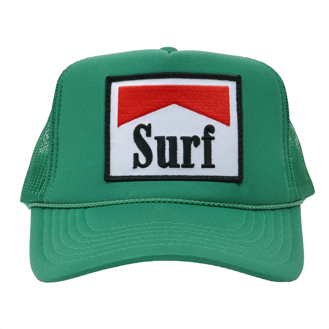 The SURF Trucker Hat by Hype Factory Inc. is a green mesh hat with an adjustable fit and a front embroidered patch featuring a red chevron above "Surf" in bold black on white.