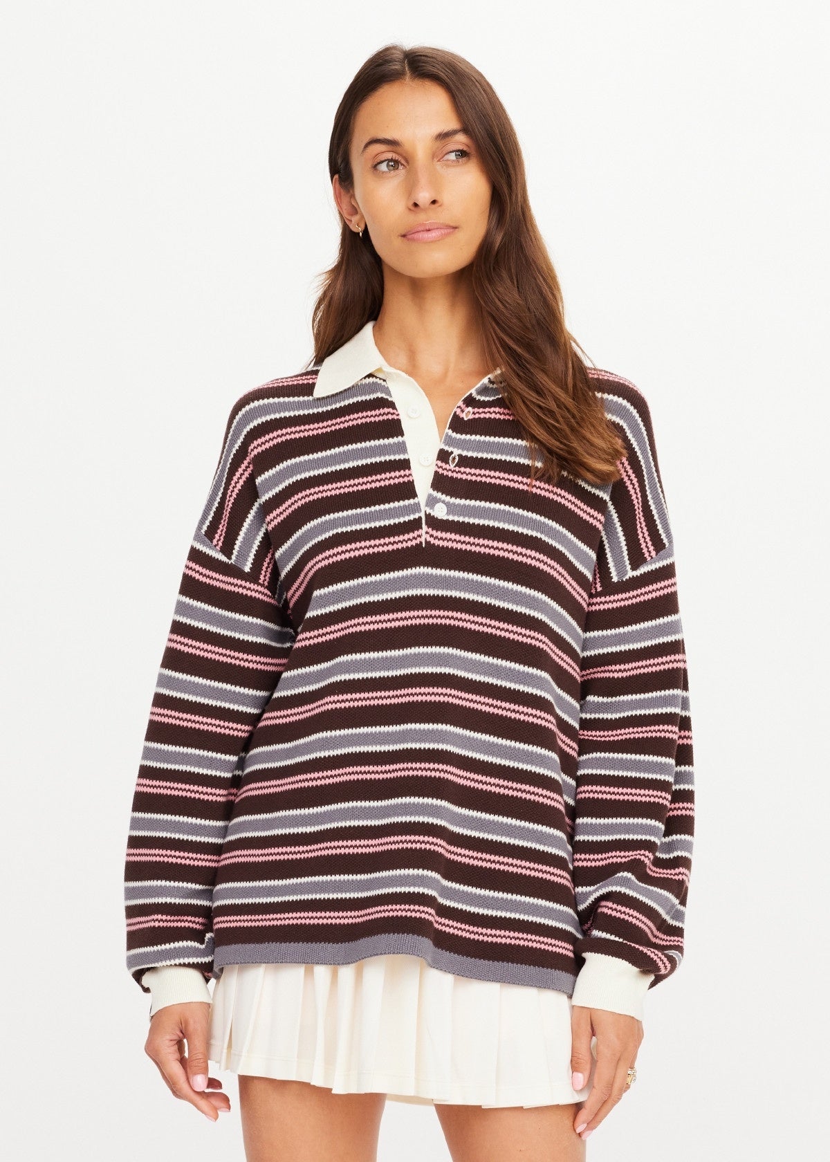 The Upside Wonder Knit Polo in cream with a white skirt, displayed against a plain white background.