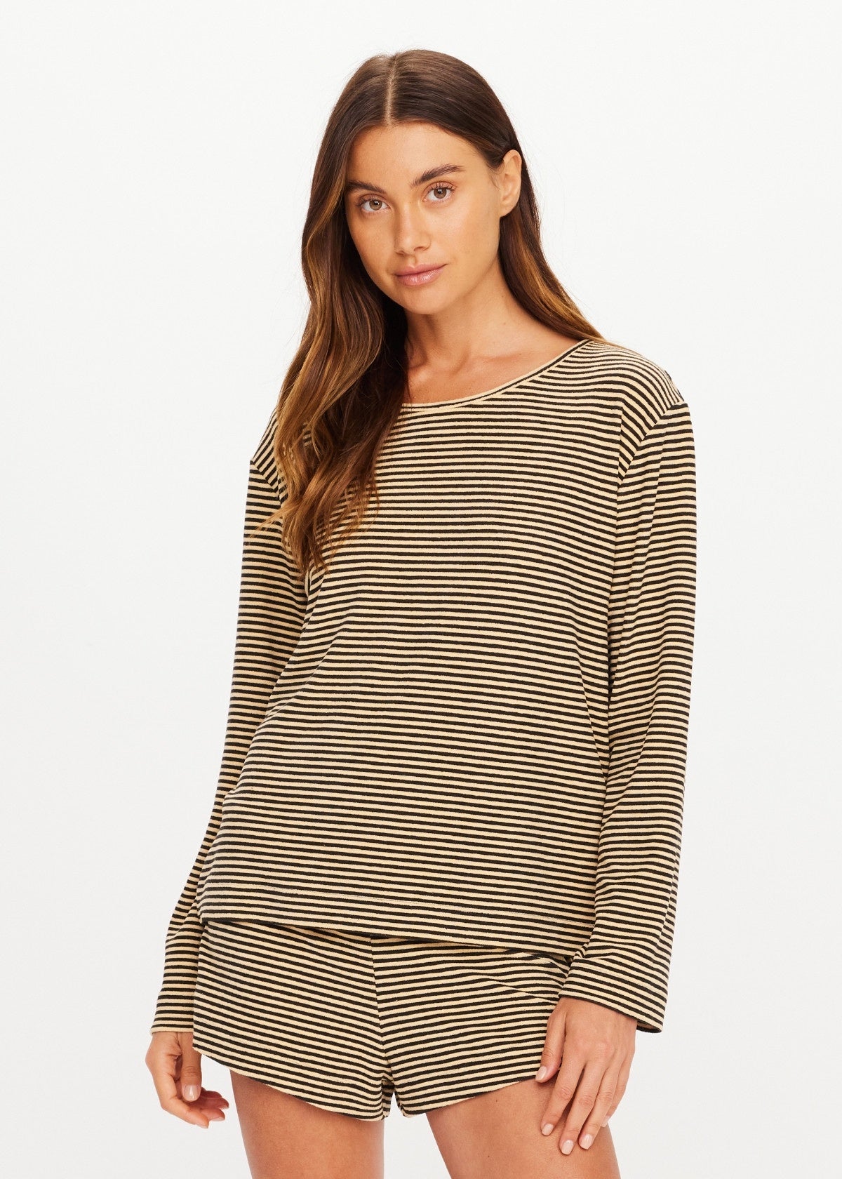 Cream and black striped long sleeve top and shorts set by The Upside, relaxed fit, against white background.