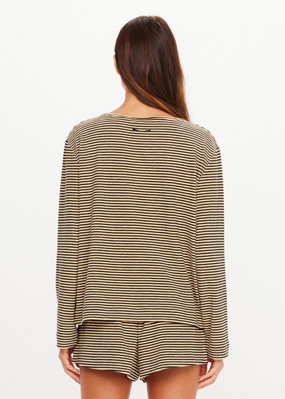 Cream and black striped long sleeve top by The Upside, Santos Rio style, shown from the back on white background.