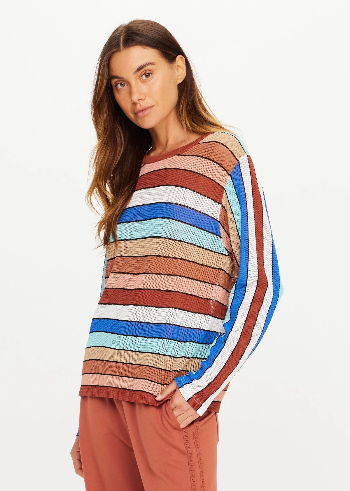 IZA MILLA long sleeve knit top in sage by The Upside, paired with rust pants against a plain background.