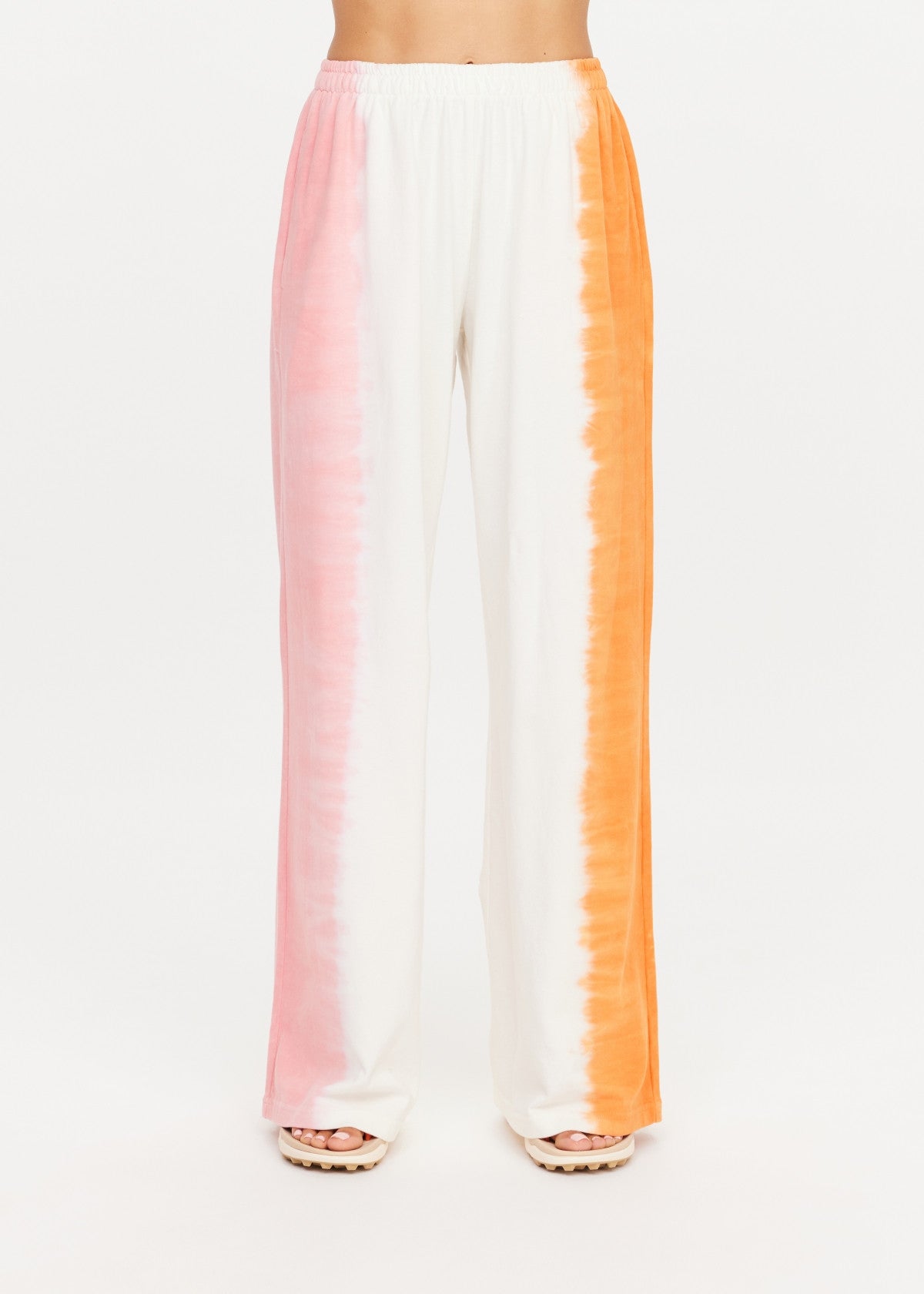 Wide leg pants with pink, white, and orange stripes by The Upside, TOKIO style.