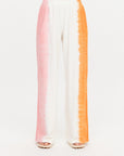 Wide leg pants with pink, white, and orange stripes by The Upside, TOKIO style.