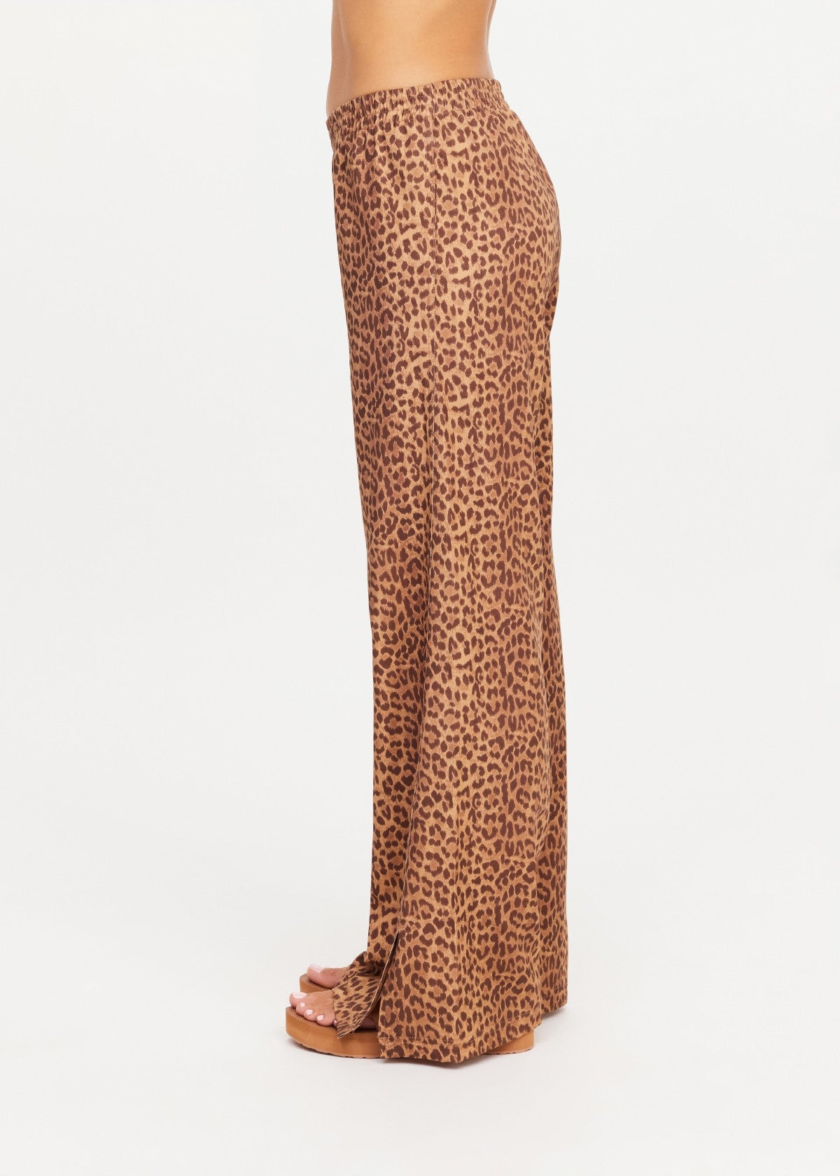 Brown leopard print JAVAN JULIET PANT by The Upside styled with sandals, side view against white backdrop.