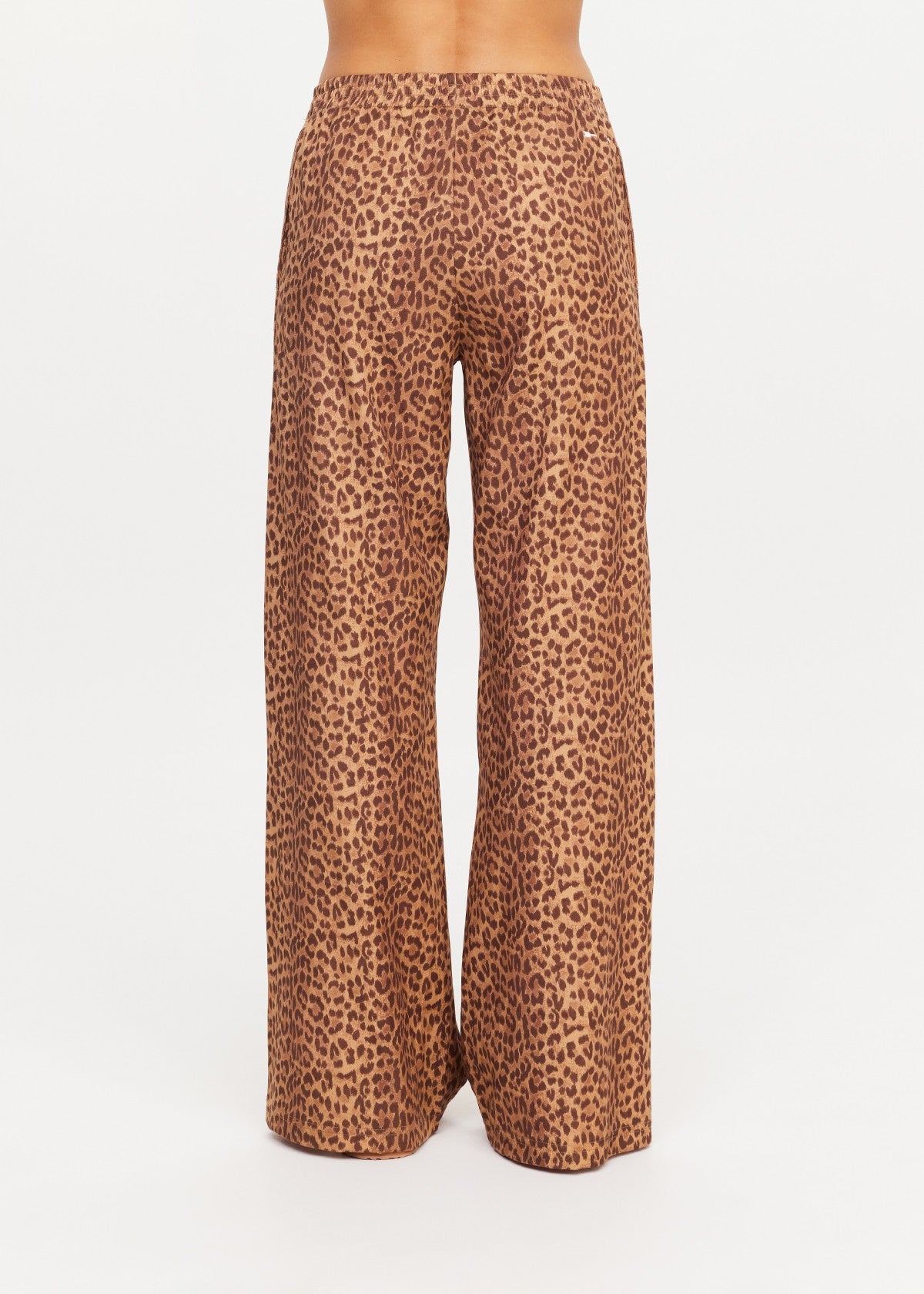 The Upside Javan Juliet Pant in high-waisted leopard twill, wide-leg style, shown from the back.