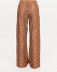 The Upside Javan Juliet Pant in high-waisted leopard twill, wide-leg style, shown from the back.