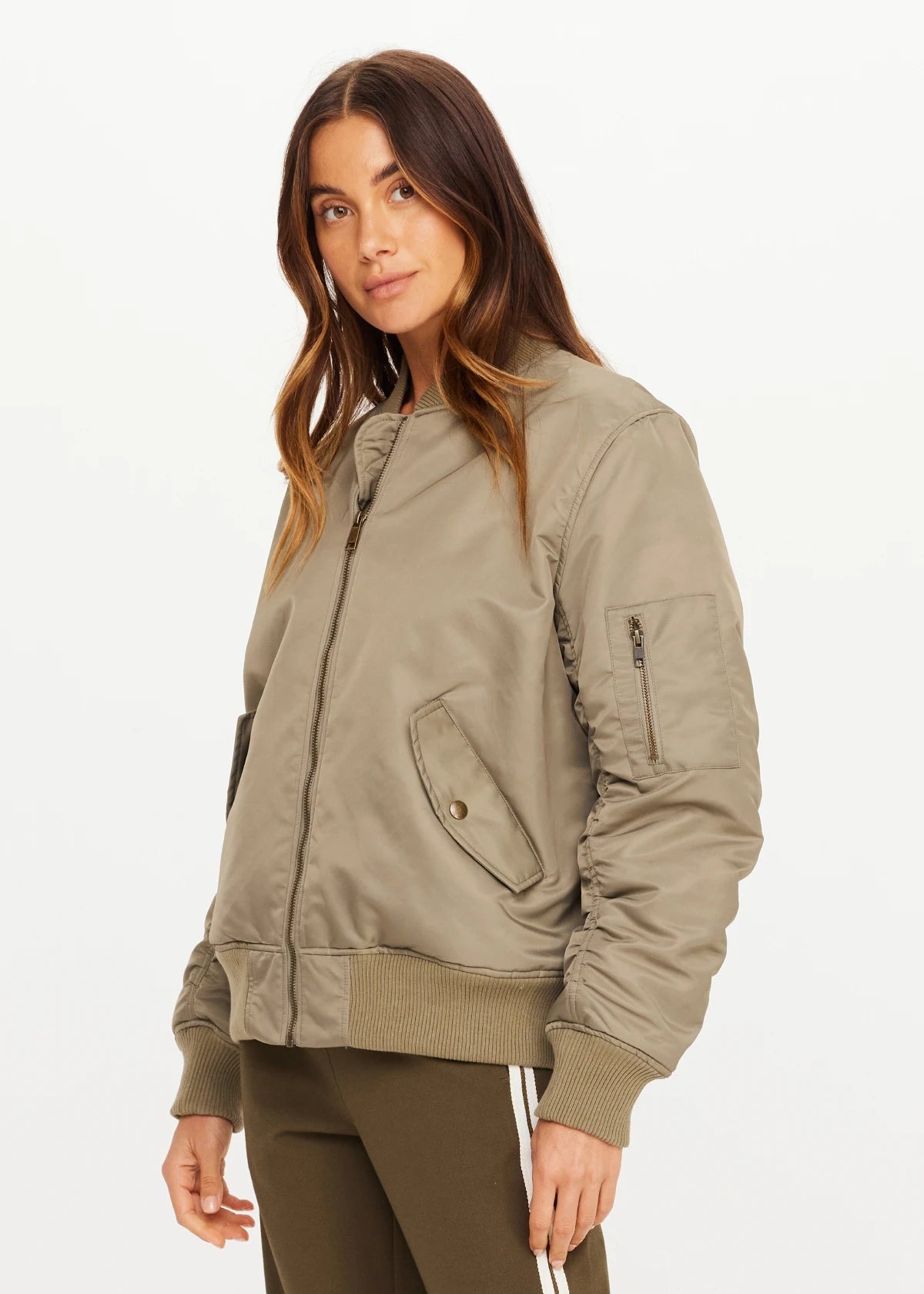 The Upside TRIBUTE BOMBER JACKET in black, front view, styled by model against white background.