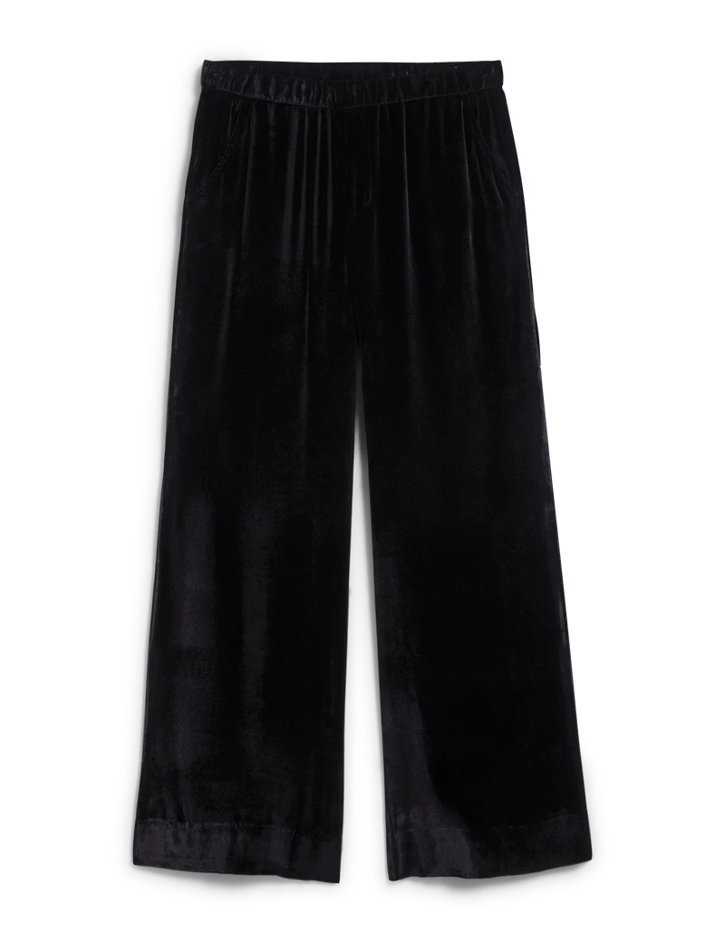 The Tuscany Getaway Maisie Pant by Frank & Eileen features loose-fitting, wide-leg black Italian Washed Velvet with an elastic waistband, shown flat on a white background.