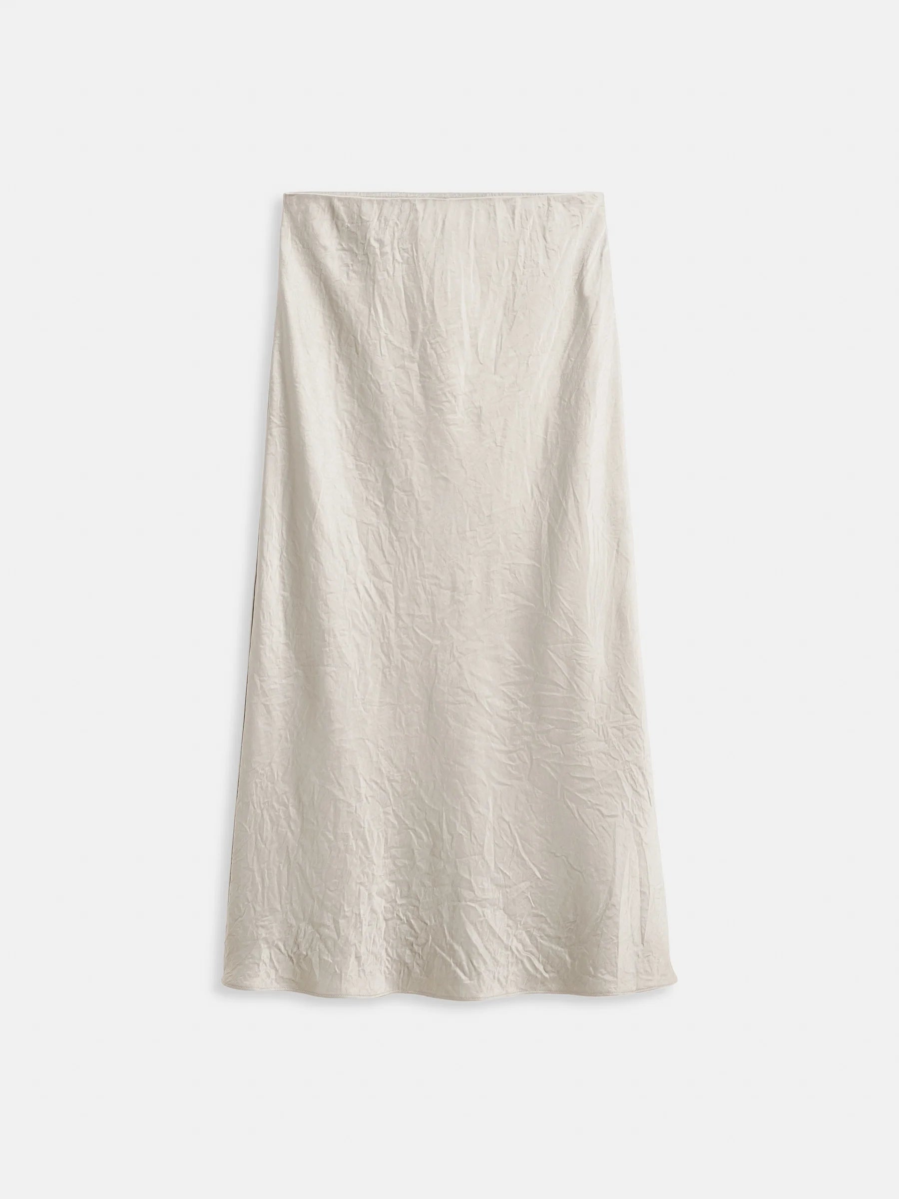 The Claire Skirt by Alex Mill is a high-waisted, off-white satin bias cut skirt with a subtle sheen and gently wrinkled texture, perfect for effortless day-to-night style. Shown against a plain white background.