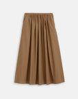 The Alex Mill Sarah Skirt is a tan, ankle-length A-line skirt with a gathered waistband and pockets, made from lightweight fabric, shown on a plain white background.