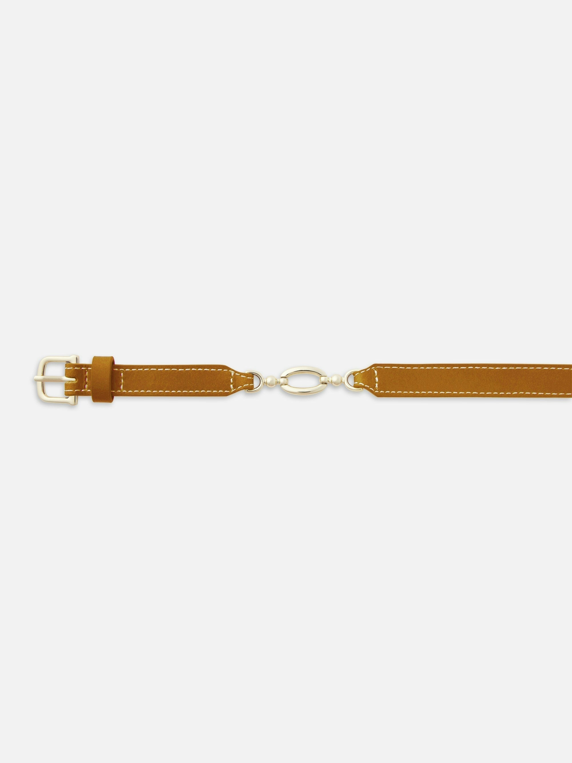 The Jewelry Detail Belt by FRAME is a tan leather waist belt with white stitching, a gold rectangular buckle, and chic gold chain detailing connecting the two straps at the center.