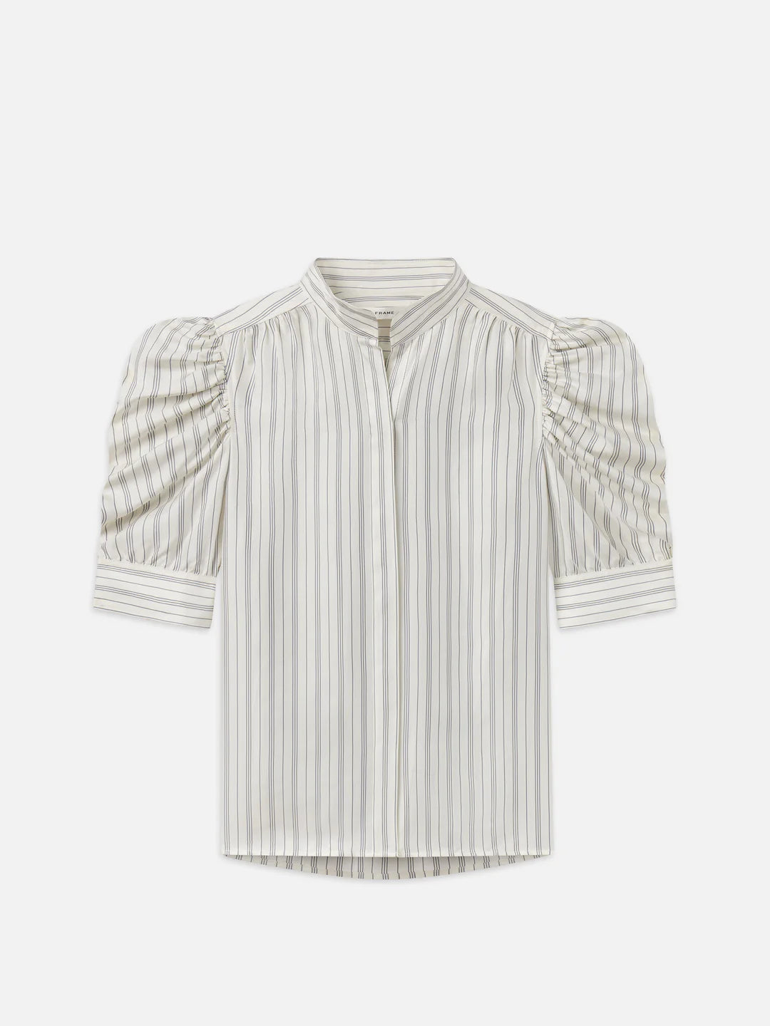 The Gillian Top by FRAME is a striped blouse featuring three-quarter length puff sleeves and a standing collar, made from soft cotton. It showcases vertical grey and white stripes with a slightly curved hemline, displayed against a plain white background.