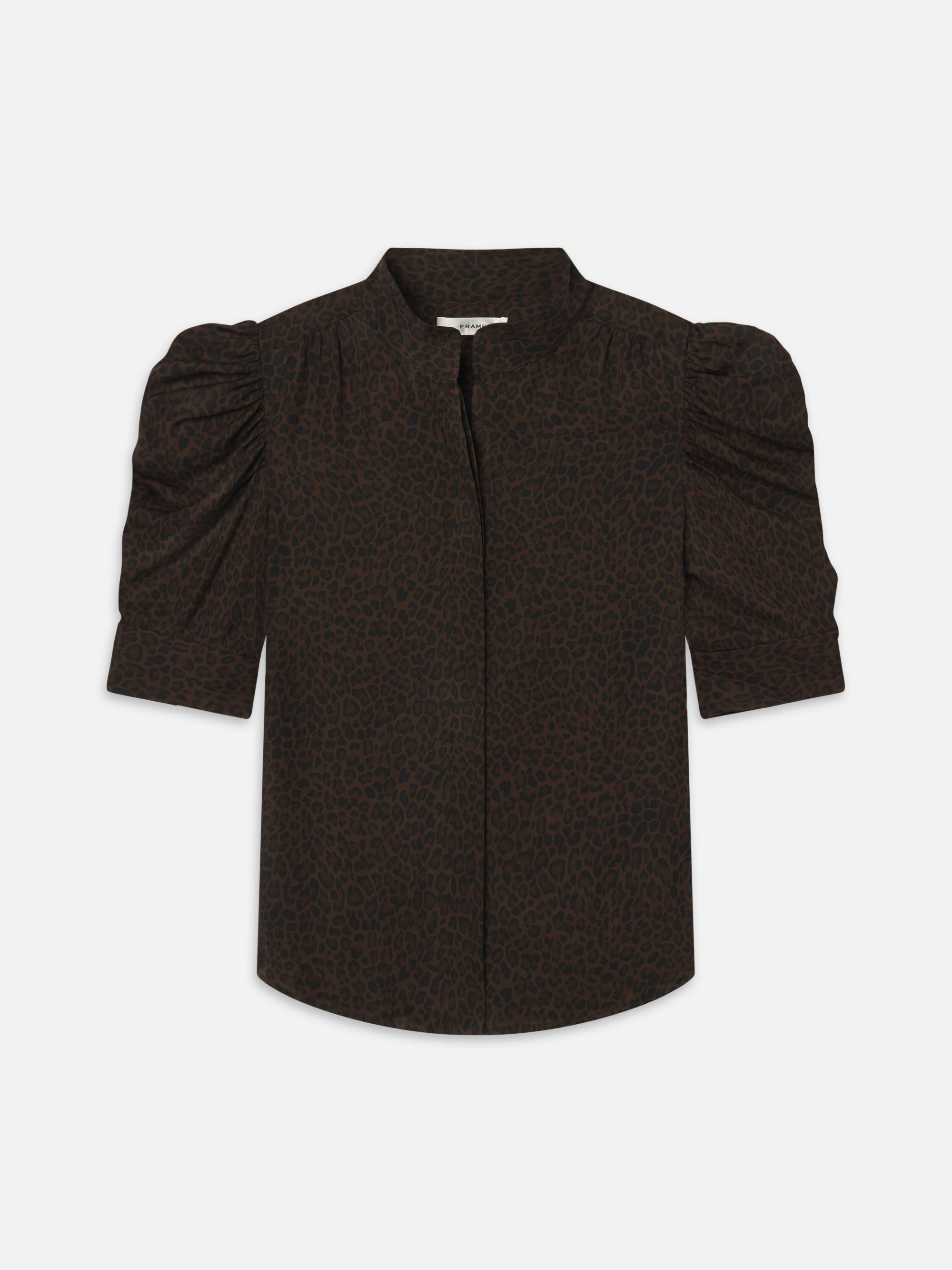 The Leopard Gillian Top by FRAME is a short-sleeved, dark brown silk blouse featuring a subtle black leopard print, puffed sleeves, round neckline, and front button closure.