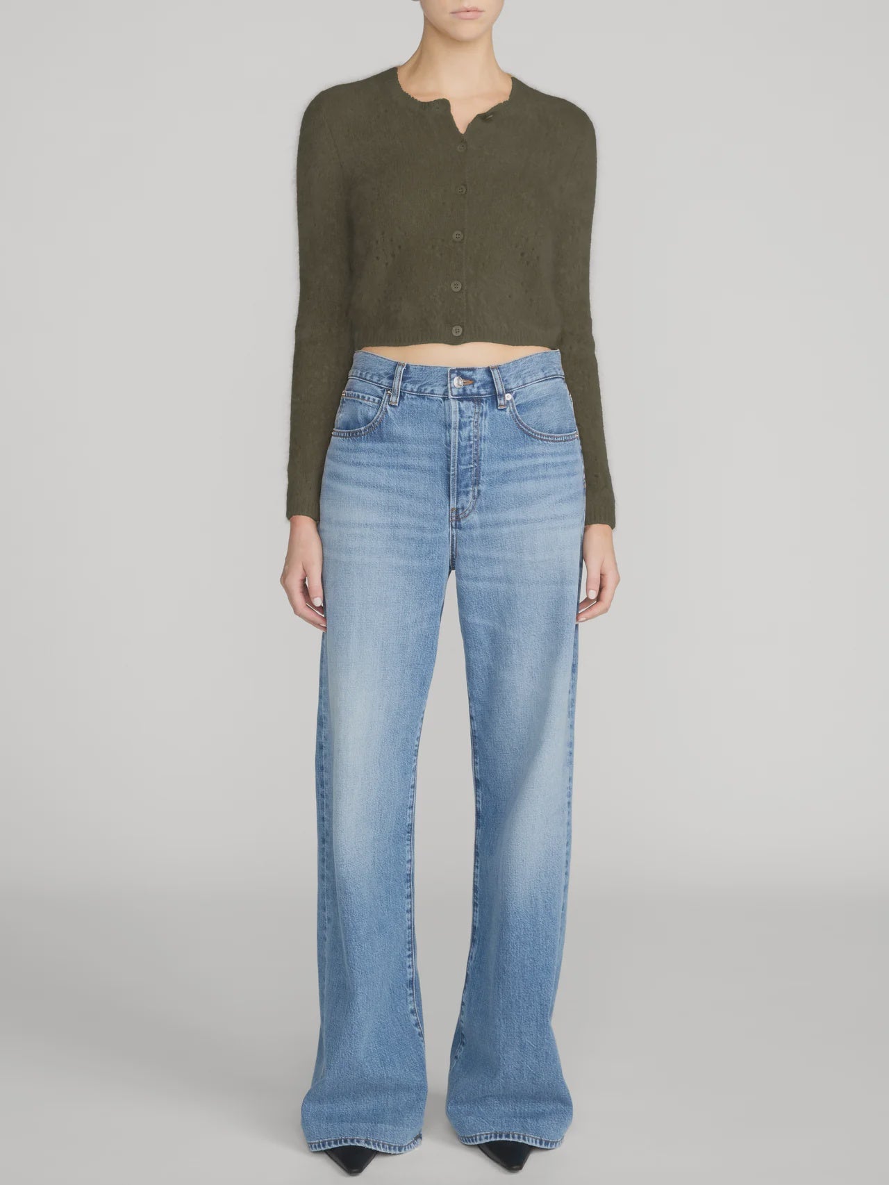FRAME Cashmere Airy Cardi paired with wide-leg blue jeans, casual style on neutral backdrop.