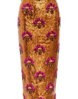 The Liza Skirt by Le Superbe is a gold sequin midi skirt with pink and brown floral embroidery, designed for a figure-flattering fit.