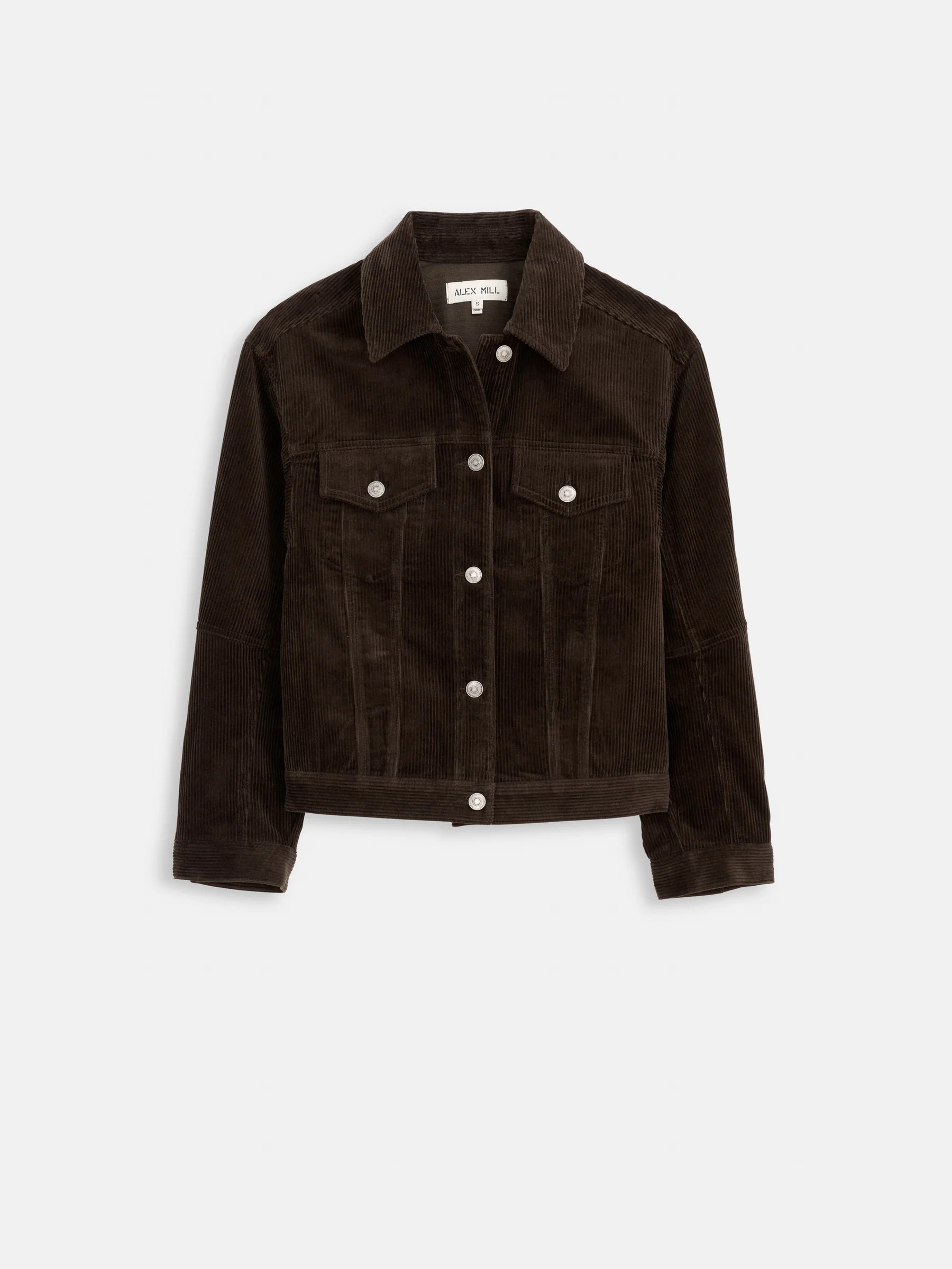 The Camden Rider Jacket by Alex Mill is a dark brown women’s corduroy jacket made from 100% cotton, featuring a cropped fit, collar, button-down front, flap chest pockets, and long sleeves—a stylish layering piece.