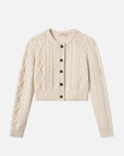 The Cable Knit Cardi by FRAME is a cream-colored, long-sleeve cashmere cardigan with a round neck, ribbed cuffs and hem, and five dark leather buttons down the front.