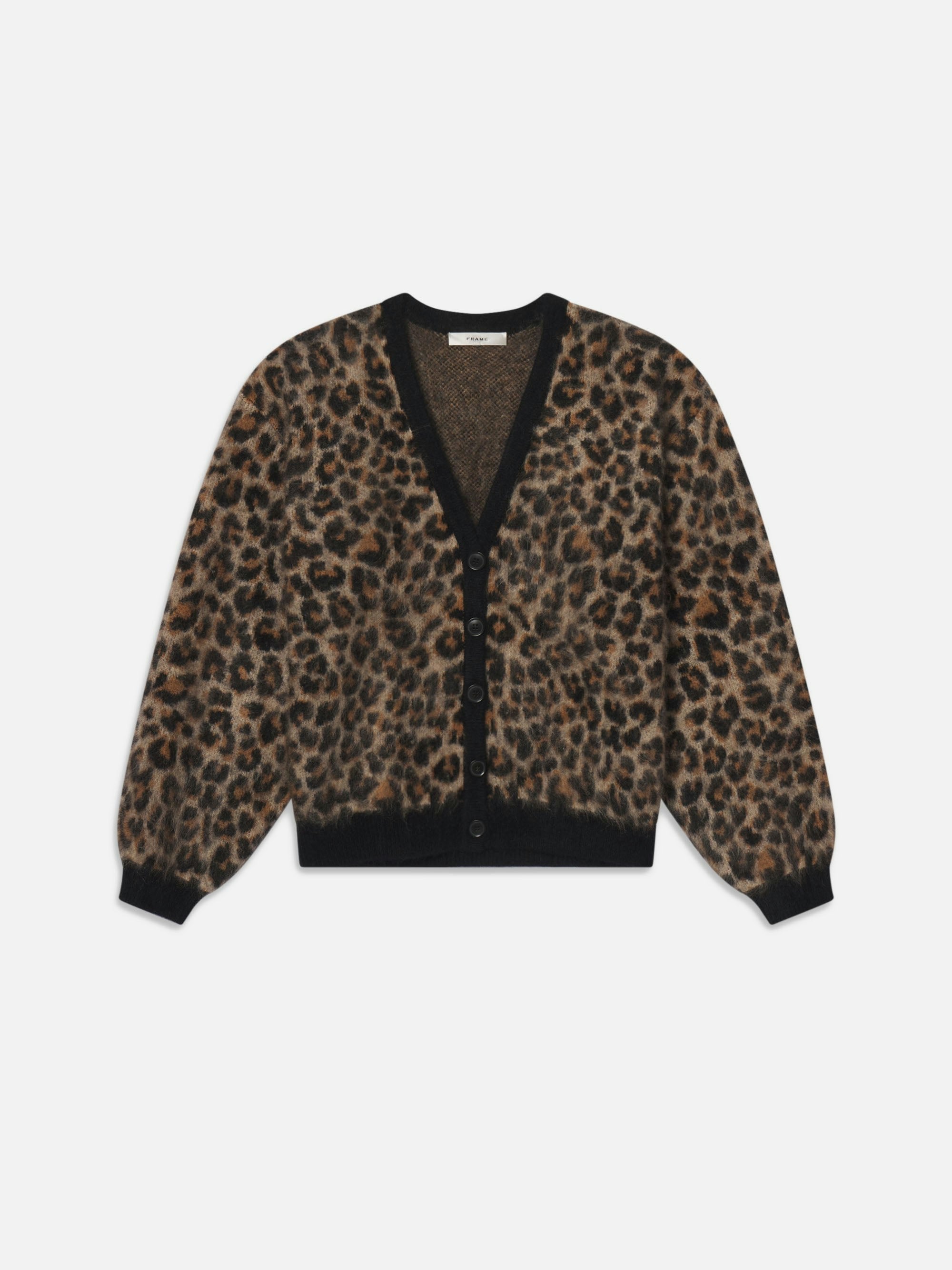 The FRAME Brushed Leopard Cardi showcases a brown and black leopard print, black buttons, and black trim at the cuffs, hem, and neckline, displayed against a white background.