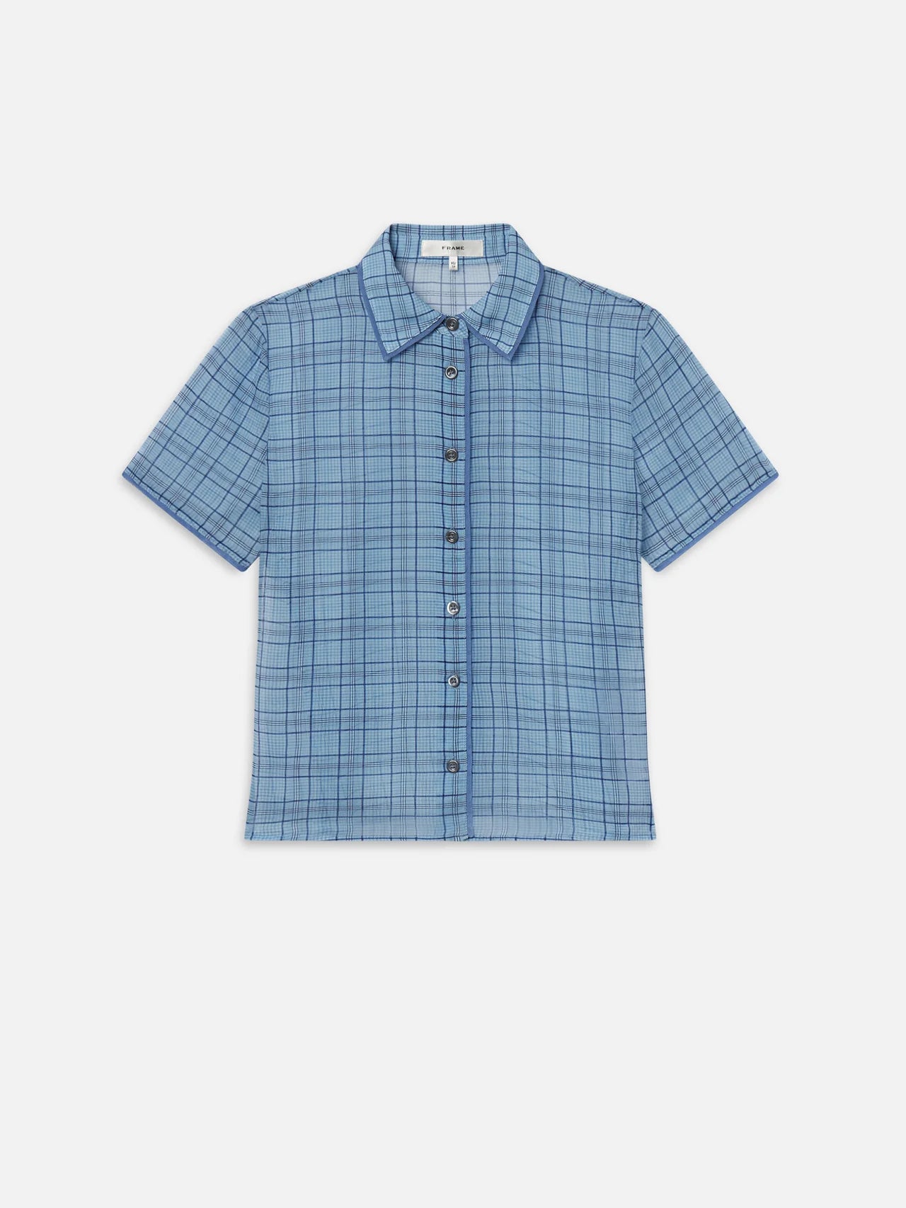 The FRAME Essential Top is a lightweight silk short-sleeve shirt with a blue plaid pattern, classic collar, and front pocket, shown on a plain white background.