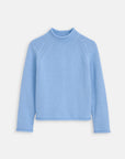 The Alex Mill Eastport Rollneck in Cotton is a light blue, long-sleeve 100% cotton sweater with a mock neck and subtle shoulder seams, shown against a plain white background.