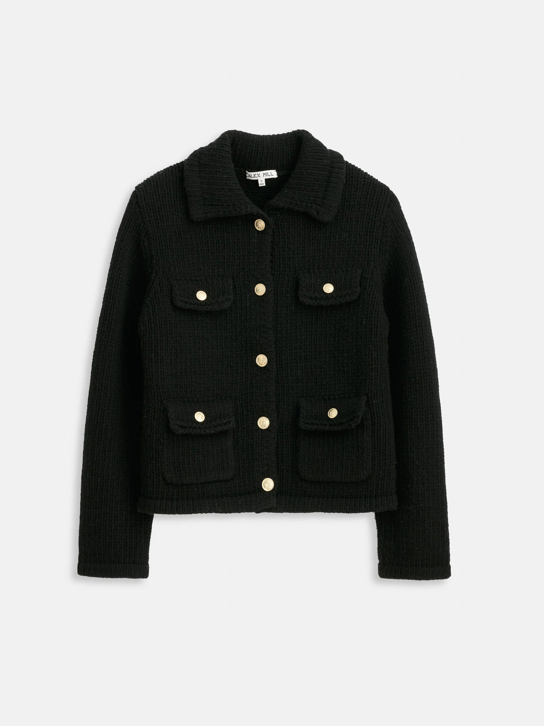 The Alex Mill Edinburgh Sweater is a black textured merino wool evening jacket with a collar, long sleeves, front gold buttons, and four flap pockets, shown against a white background.