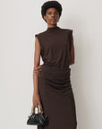 Sessun DATZ short sleeve T-shirt in white styled with a black handbag, shown against a white backdrop.