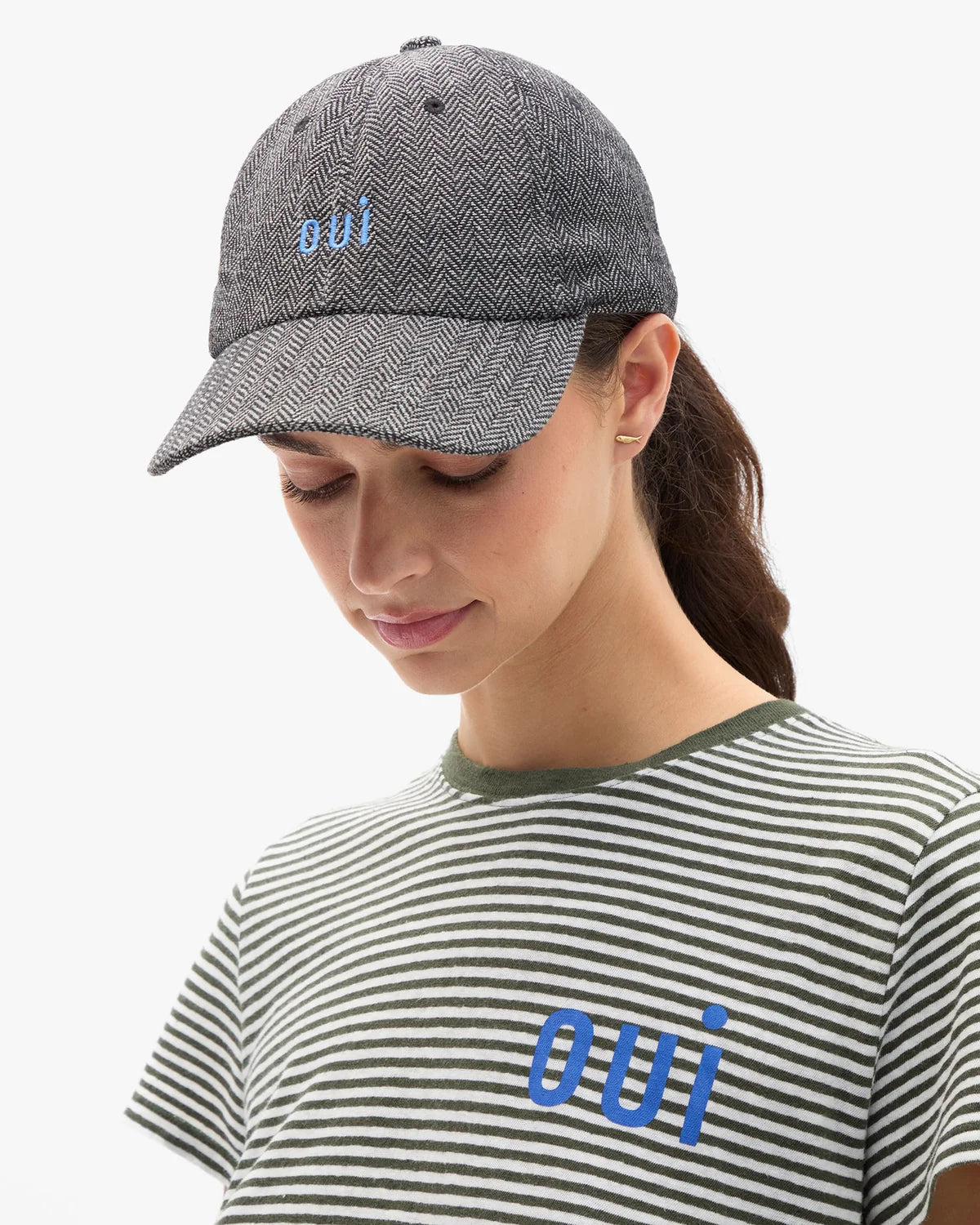 Clare Vivier wool baseball hat with oui text, cozy winter accessory in dark fabric at Bungalow Furniture &amp; Accessories.