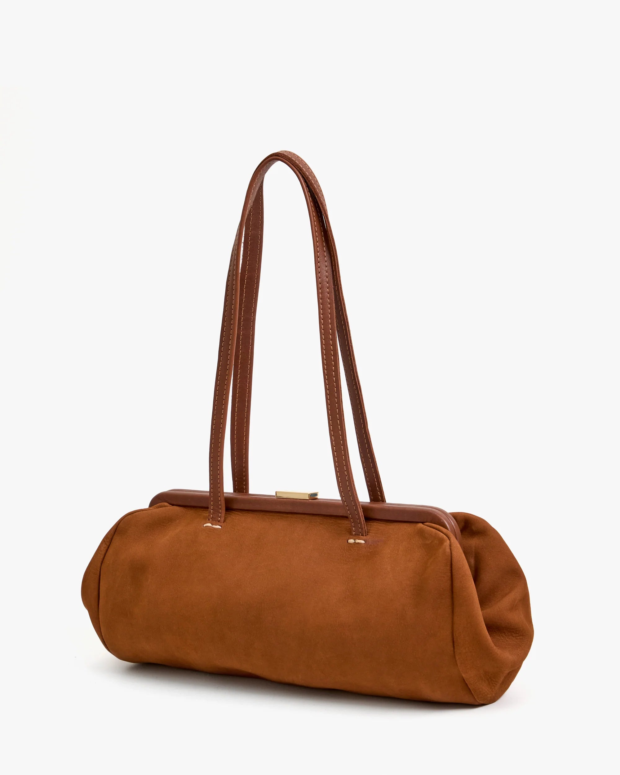 The Clare Vivier Yvette Smooth Nubuck is a brown suede shoulder bag with a rectangular shape, double long leather straps, and a gold-tone clasp, shown against a plain white background.