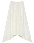 The DOEN Zinnia Skirt is a long white lace skirt with a caftan style, handkerchief asymmetrical hem, and drawstring waist, shown against a plain white background.