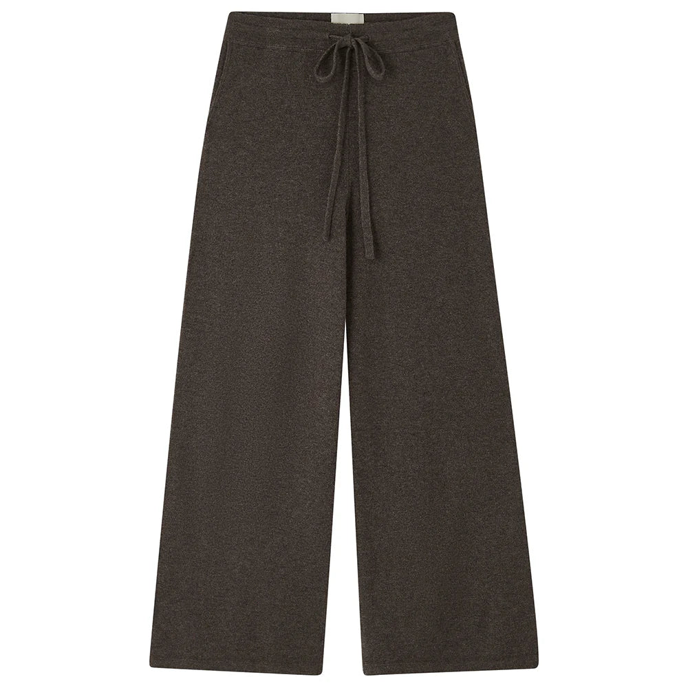 The Wide Leg Joggers by Jumper 1 2 3 4/CR2 are dark brown knit pants in soft merino wool, featuring an elastic waistband and front drawstring, shown against a white background.