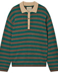 The Merino Rugby Shirt by Jumper 1 2 3 4/CR2 is a long-sleeved top with green and brown horizontal stripes, featuring a beige collar and button placket.